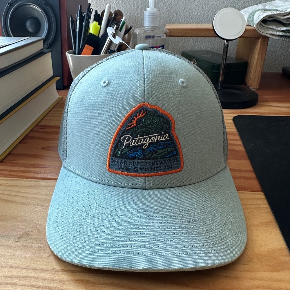 NWT: Patagonia Sky Blue Trucker Hat with Orange Patch